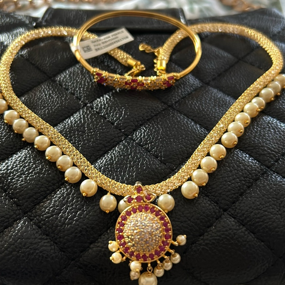 14k Gold NEW necklace with rubies and crystals. Will not blacken by water/sweat